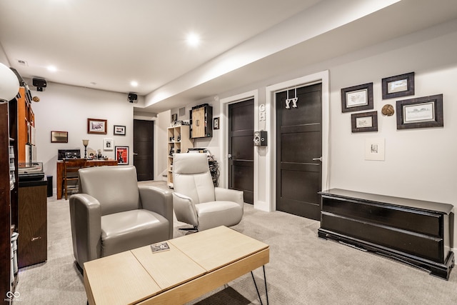 living room with light carpet and recessed lighting