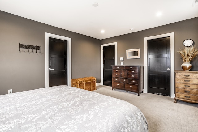 bedroom featuring carpet and ensuite bath