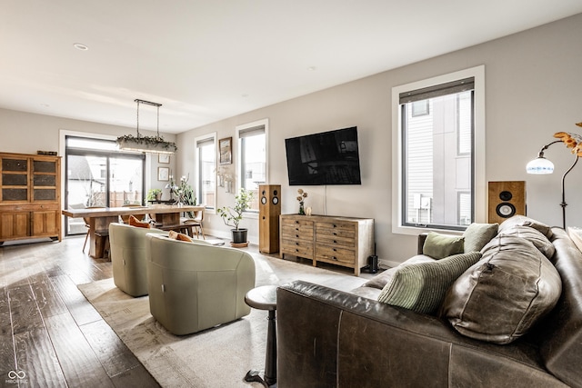 living room with light wood finished floors and baseboards