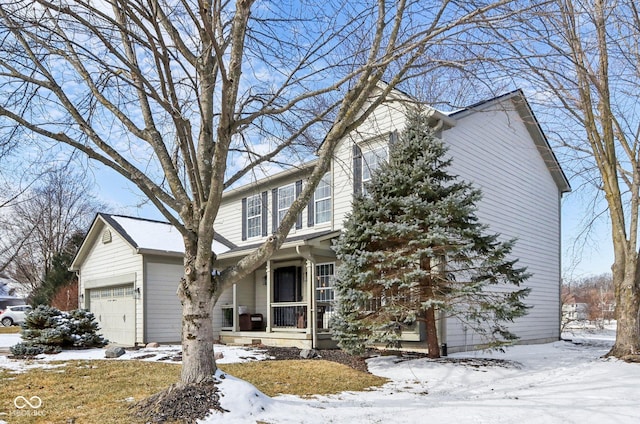 view of front of property with an attached garage and a porch