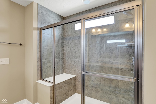 bathroom featuring a shower stall