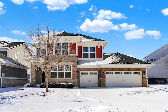 view of front of property with an attached garage and brick siding