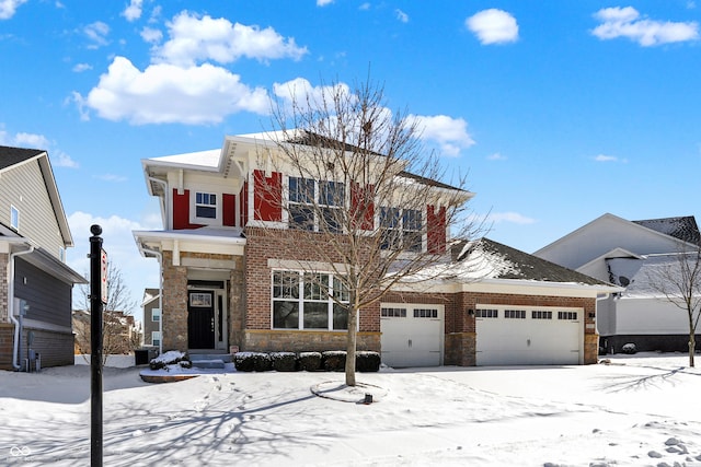 view of front of house featuring brick siding and an attached garage