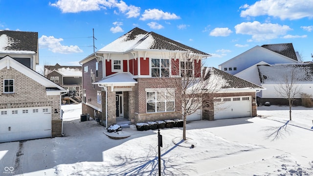 view of front of property featuring a garage and brick siding