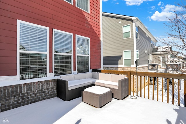 wooden terrace with an outdoor hangout area