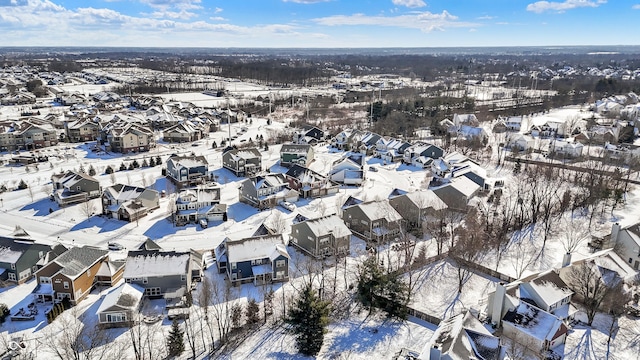 snowy aerial view featuring a residential view