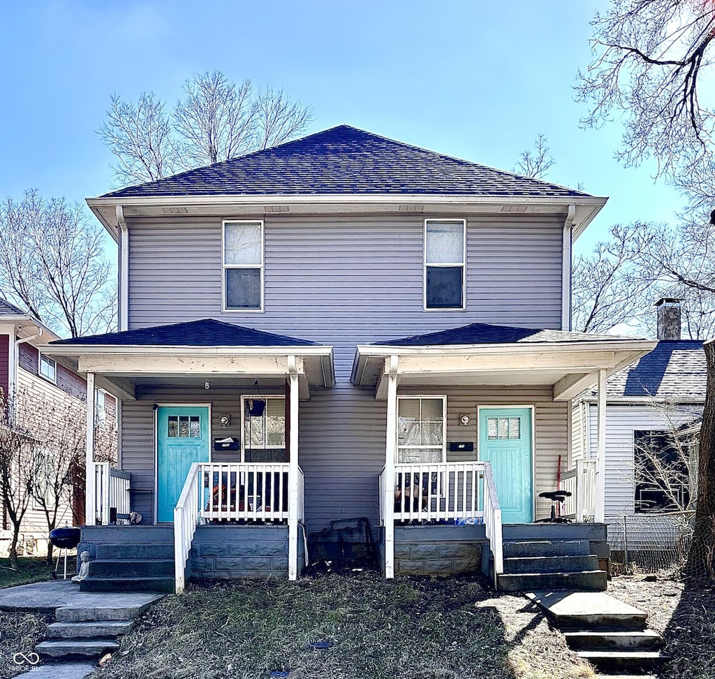 view of front of house with covered porch and roof with shingles