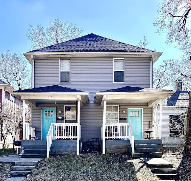 view of front of house with covered porch and roof with shingles