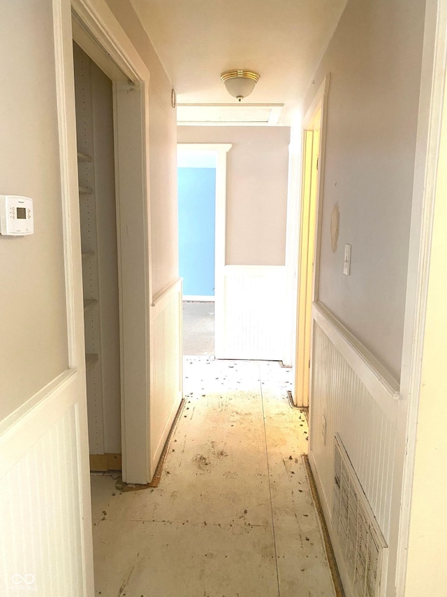 corridor featuring wainscoting and visible vents