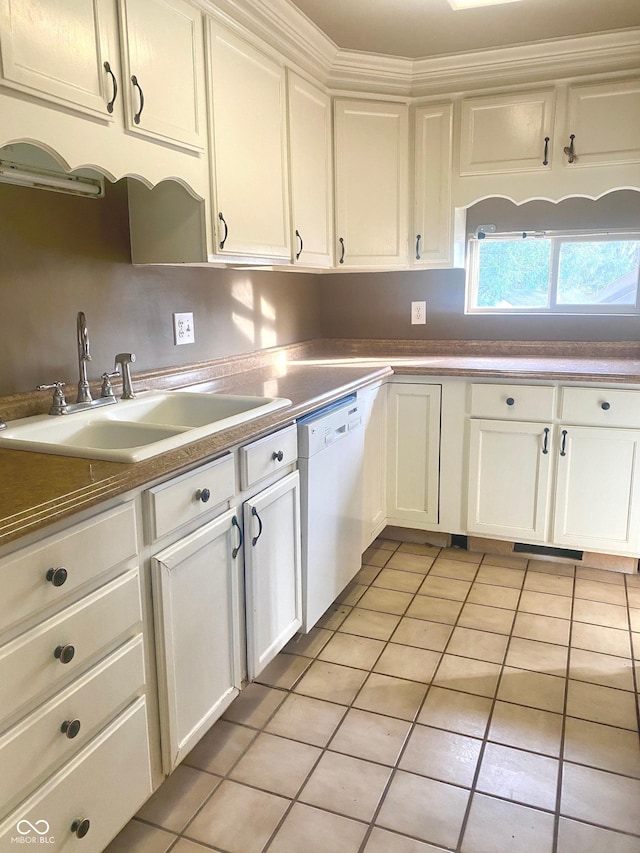 kitchen featuring a sink, white cabinetry, and dishwasher