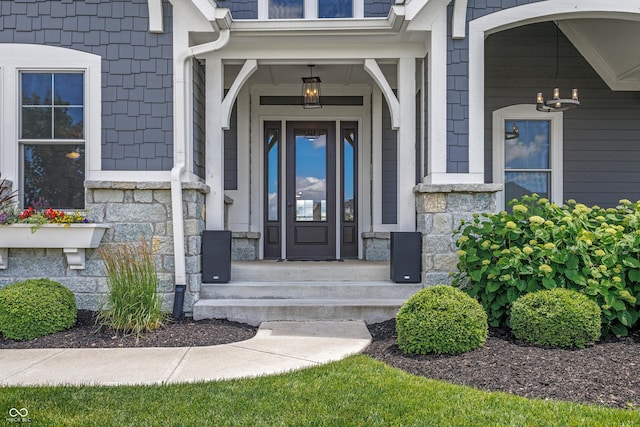 doorway to property with stone siding