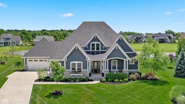 craftsman house with a front yard, covered porch, and driveway