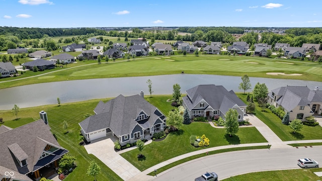 birds eye view of property featuring a water view, view of golf course, and a residential view