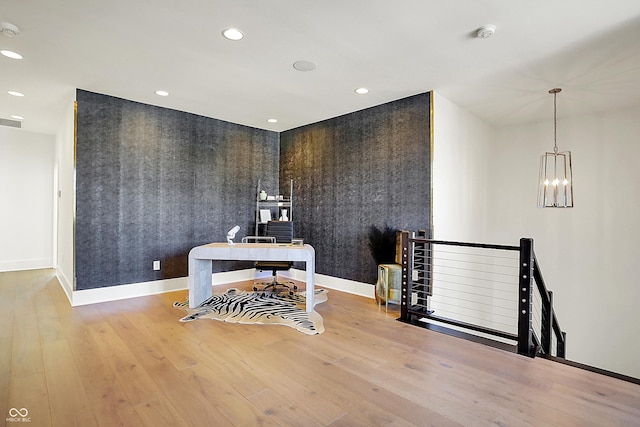 office featuring recessed lighting, wood finished floors, an inviting chandelier, and baseboards