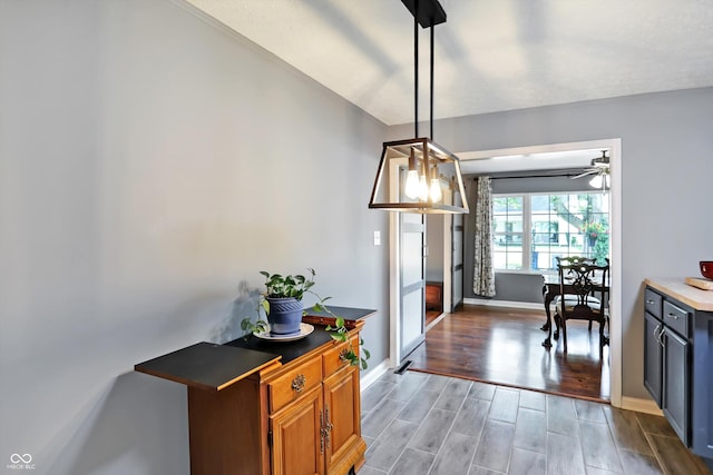 interior space featuring wood finish floors and baseboards