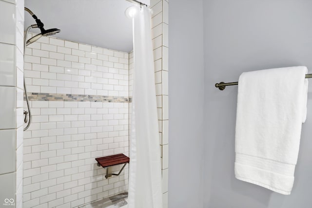 full bathroom with a tile shower