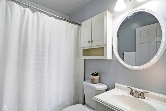 full bathroom with vanity and toilet