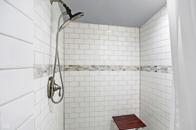 full bath featuring tiled shower