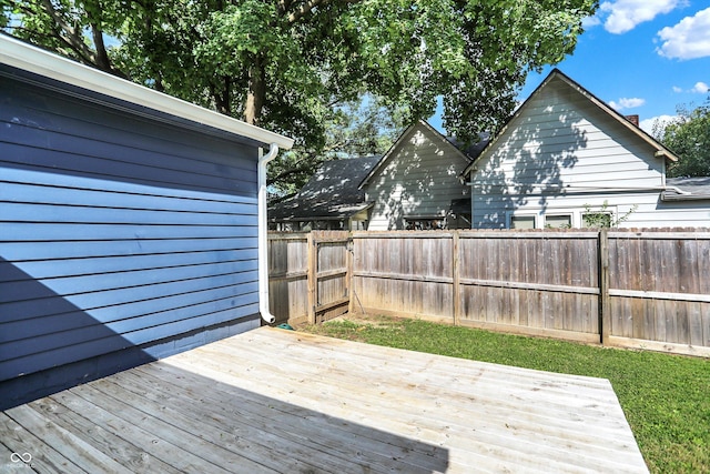 wooden deck featuring a fenced backyard