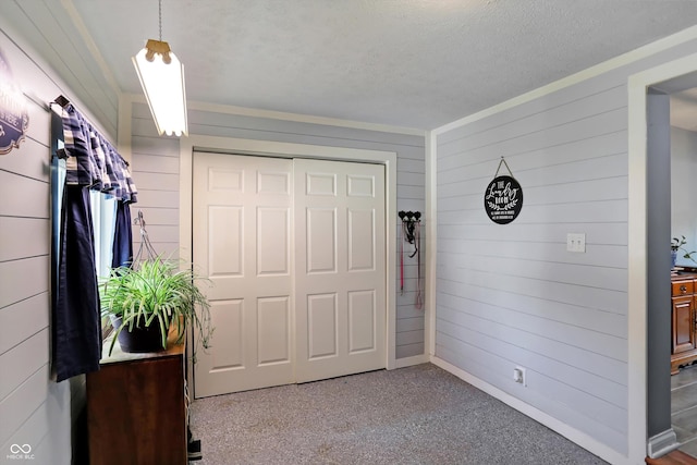 interior space featuring a textured ceiling