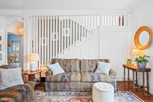 living area featuring stairs and wood finished floors