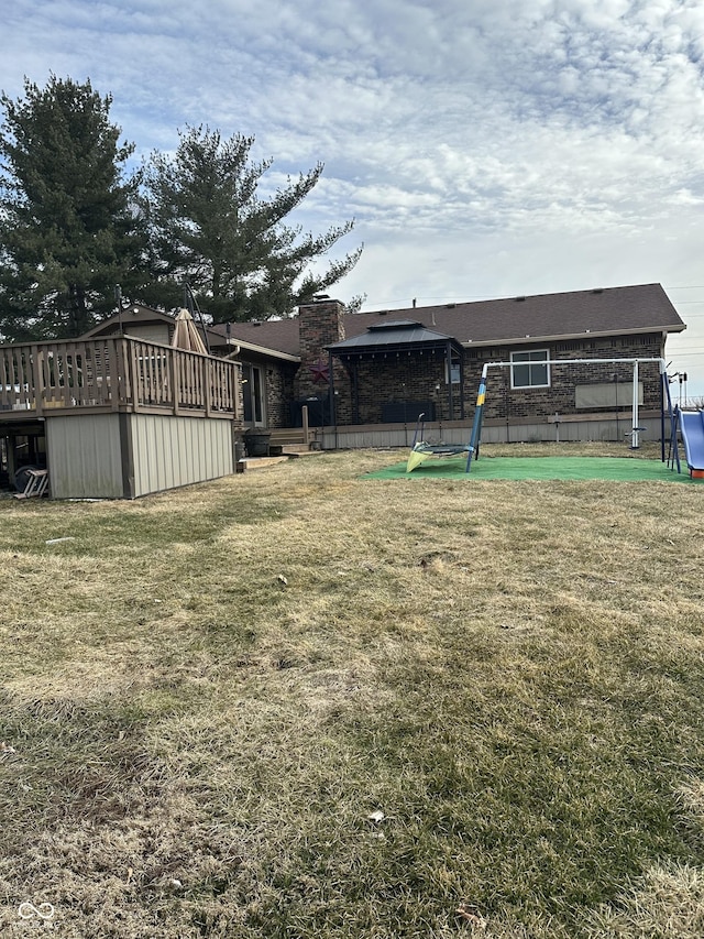 view of yard with a wooden deck and a gazebo