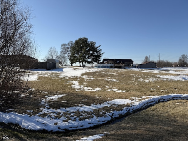 view of yard layered in snow