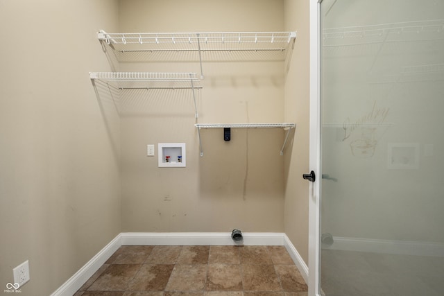 laundry area featuring washer hookup, laundry area, and baseboards