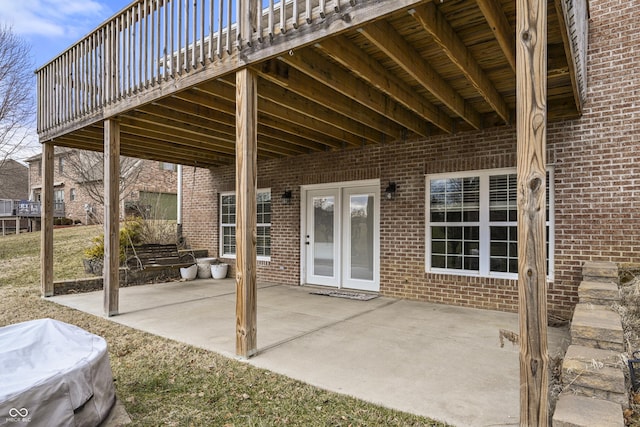 view of patio / terrace with french doors and a wooden deck