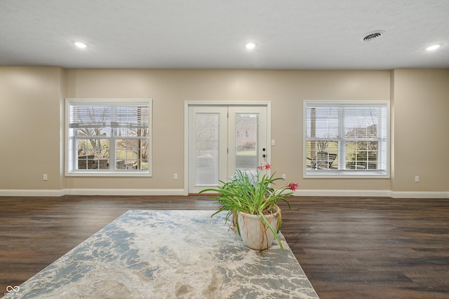 dining space featuring wood finished floors, visible vents, and recessed lighting