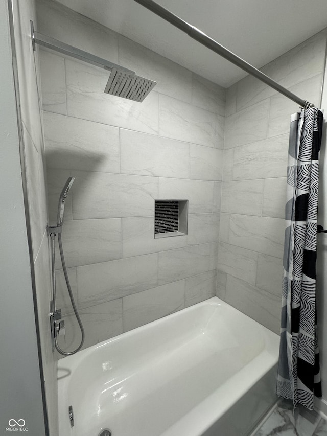 bathroom featuring shower / bath combo with shower curtain