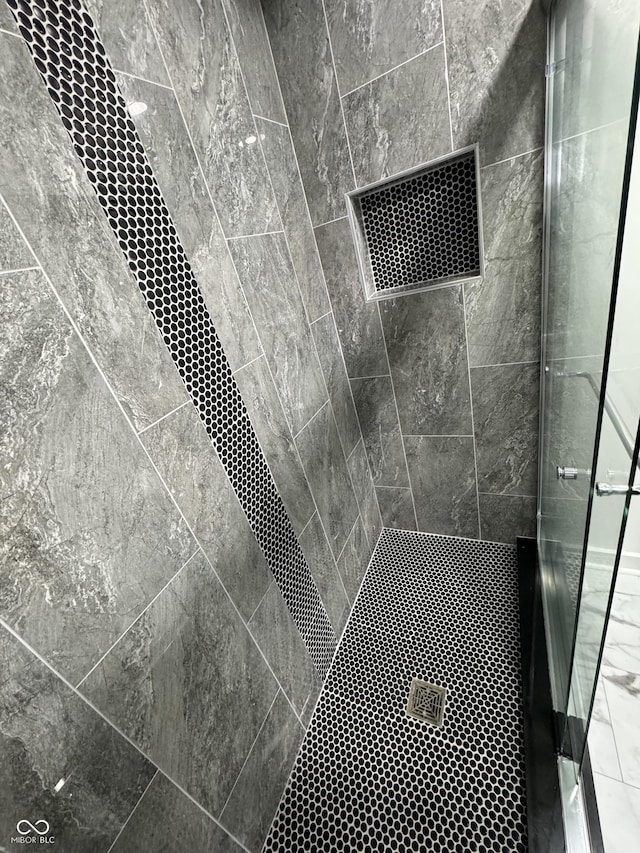 room details featuring a stall shower and visible vents