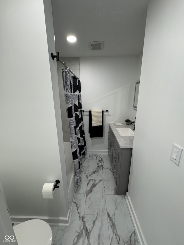 full bathroom featuring marble finish floor, visible vents, baseboards, and vanity