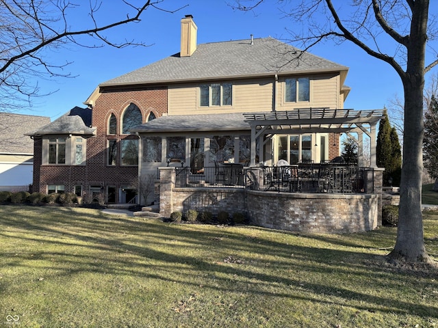 back of property with a yard, a pergola, a shingled roof, a chimney, and brick siding