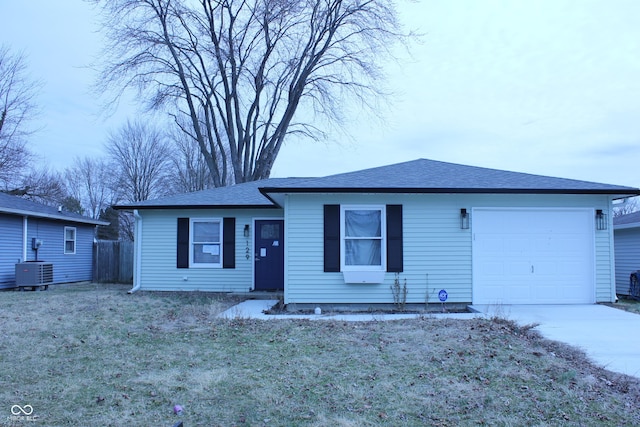 view of front of property with central air condition unit, an attached garage, fence, driveway, and a front lawn