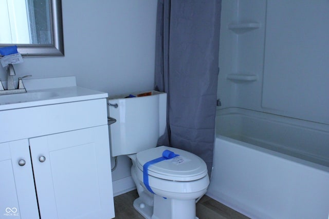 full bathroom with toilet and vanity