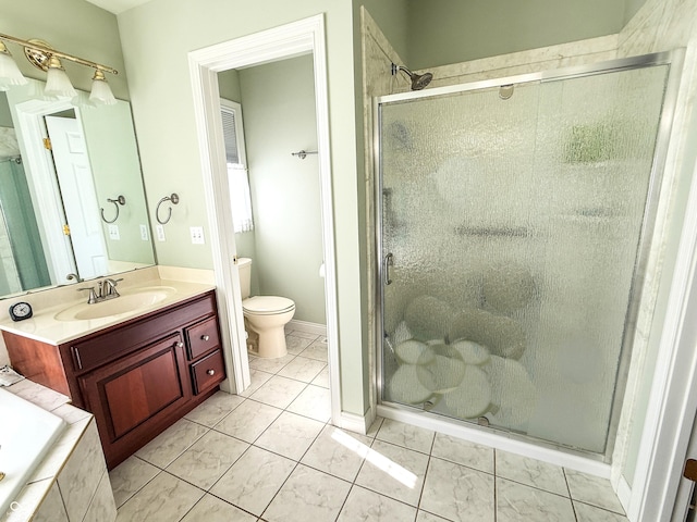 full bath featuring a relaxing tiled tub, a stall shower, vanity, and toilet