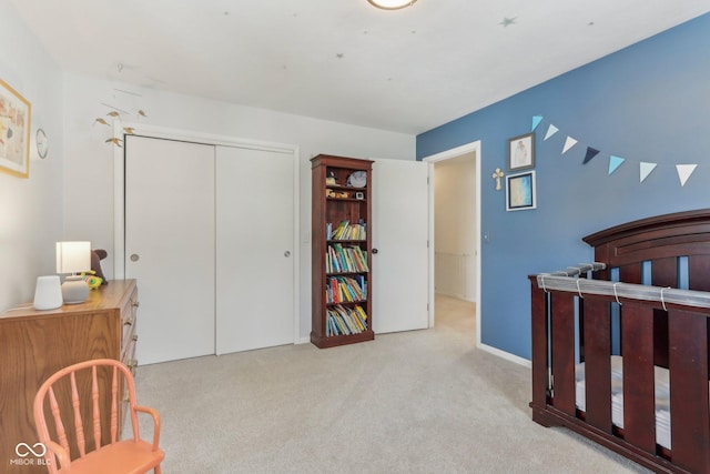 bedroom with carpet flooring and a closet