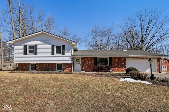 tri-level home featuring an attached garage and a front yard