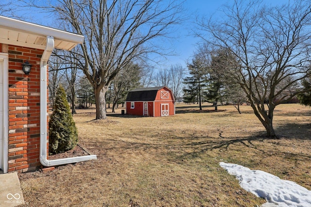 view of yard with a barn and an outdoor structure