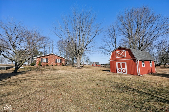 view of yard with a barn and an outdoor structure