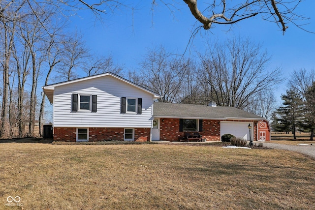 tri-level home featuring an attached garage, central AC, driveway, and a front yard