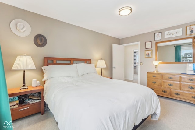 bedroom featuring light colored carpet