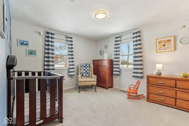 bedroom with baseboards, carpet floors, and visible vents