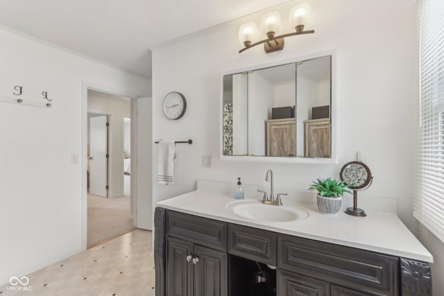 full bathroom featuring ornamental molding and vanity