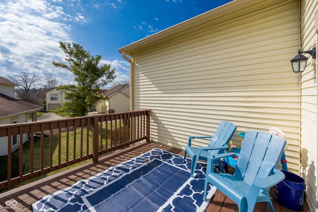 wooden terrace with a yard