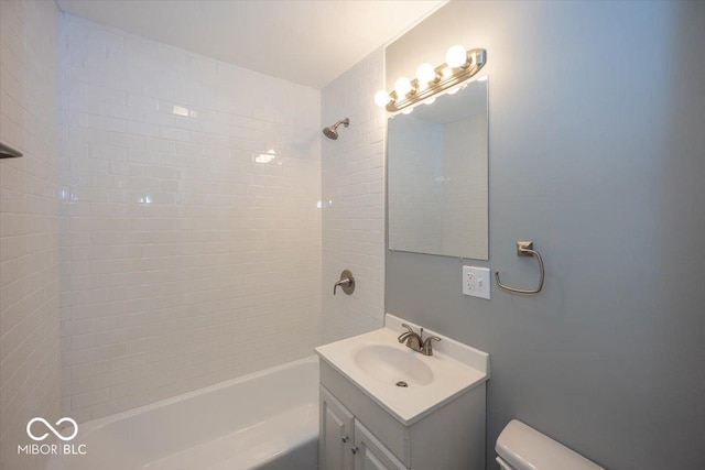 bathroom featuring shower / bath combination, toilet, and vanity