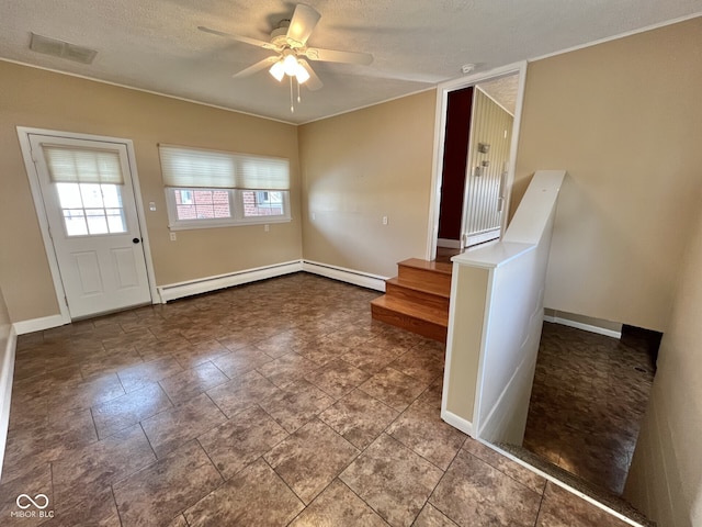 entryway with ceiling fan, a textured ceiling, visible vents, baseboards, and baseboard heating