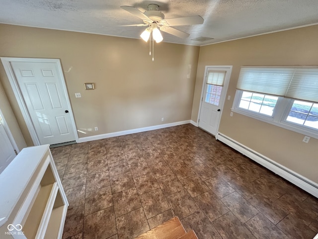 entryway featuring ceiling fan, a textured ceiling, a baseboard radiator, and baseboards