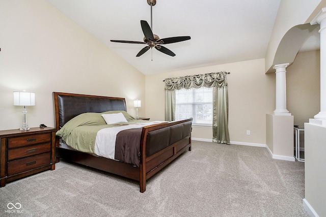 bedroom featuring decorative columns, baseboards, a ceiling fan, vaulted ceiling, and carpet flooring